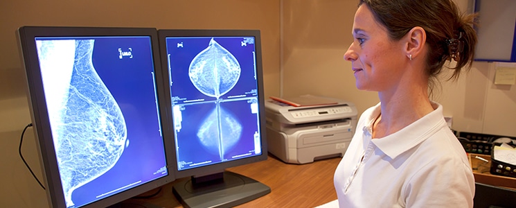 radiologist looking at mammogram results at PURE Mammography