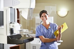 nurse with mammogram machine