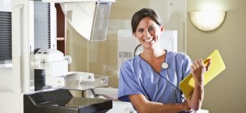 nurse with mammogram machine