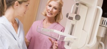 woman getting mammogram