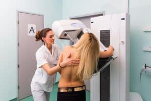 woman getting mammogram