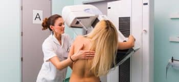 woman getting mammogram