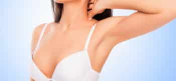 Young women in bra prior to Vampire Breast Lift Procedure utilizing Platelet Rich Plasma (PRP)